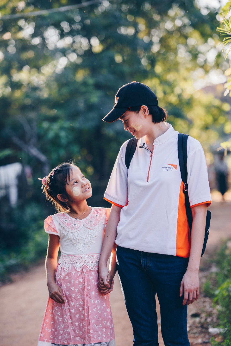 Now an ambassador for World Vision Singapore, she said: "I want to be a vessel of love for Him." She is pictured here with her sponsored children from Myanmar, Kyine Kyine, in a trip last January. Photo courtesy of World Vision Singapore.