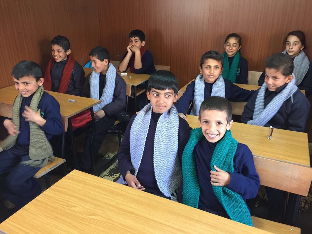 Syrian Refugee Children receiving LoveME scarves at refugee schools