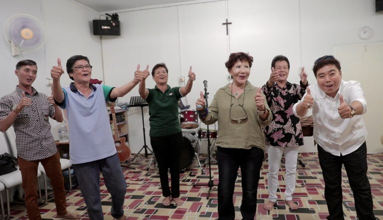 Ooi Kooi Tin (with sunglasses) leading her Tanjung Pinang congregation in lively worship.. Photo courtesy of Ooi Kooi Tin.,