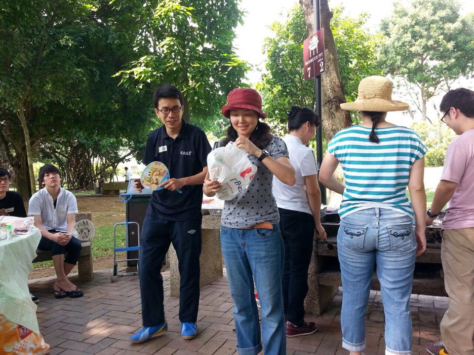Pastor Tak (in black) and his wife, Suzuko (in red hat), hosting a barbecue outreach to Japanese living in Singapore.