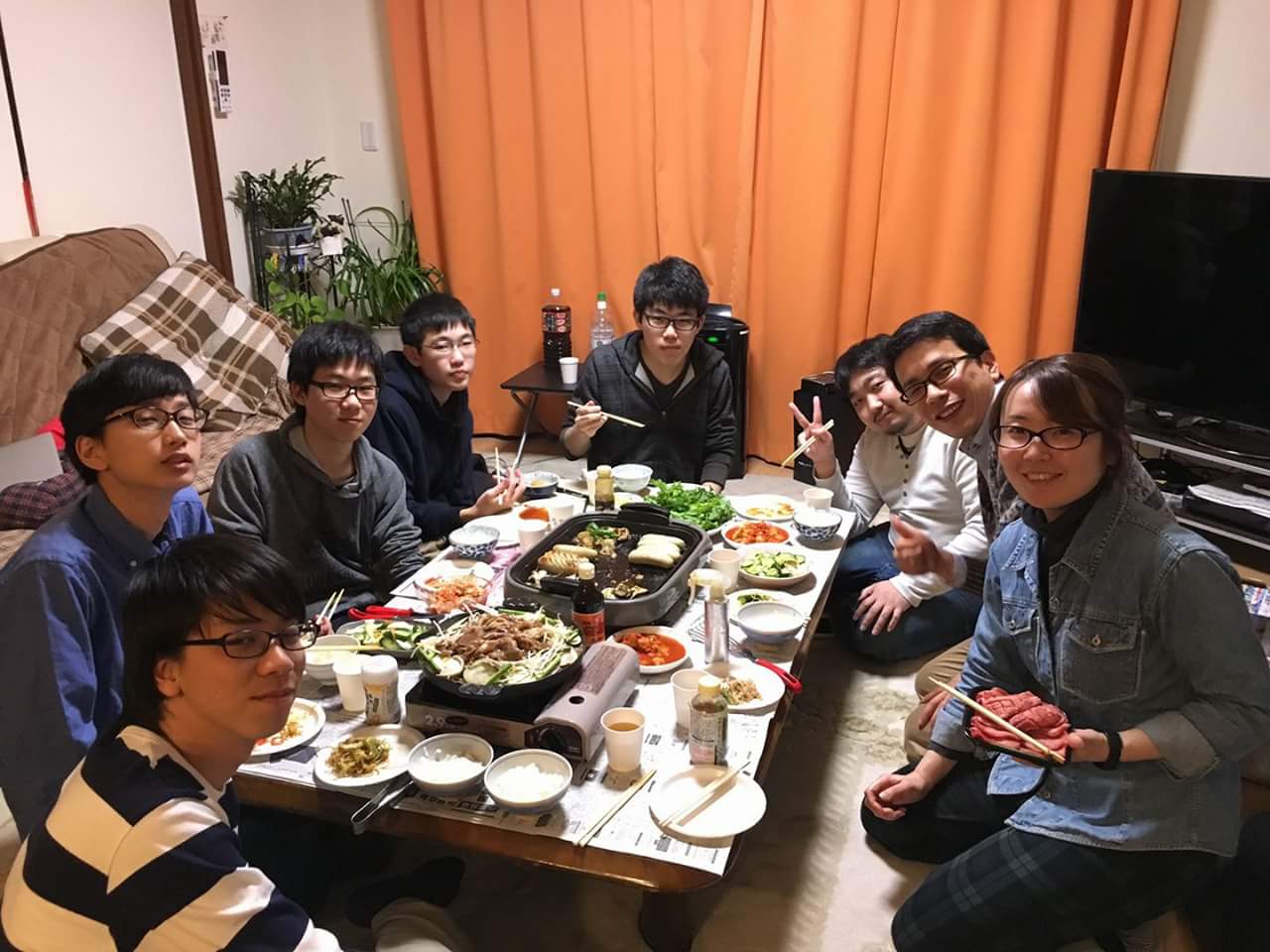 Pastor Tak and Suzuko (rightmost) sharing a meal with the youths.