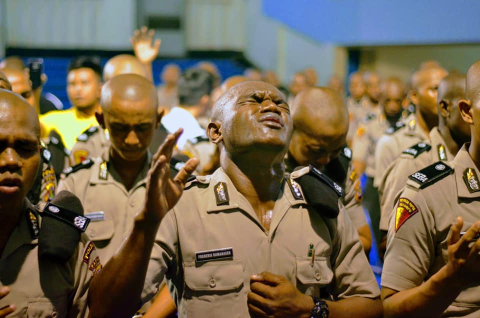 A police cadet worshipping at the open crusade headlined by Dr Suzette Hattingh in Jayapura, Papua, Indonesia.