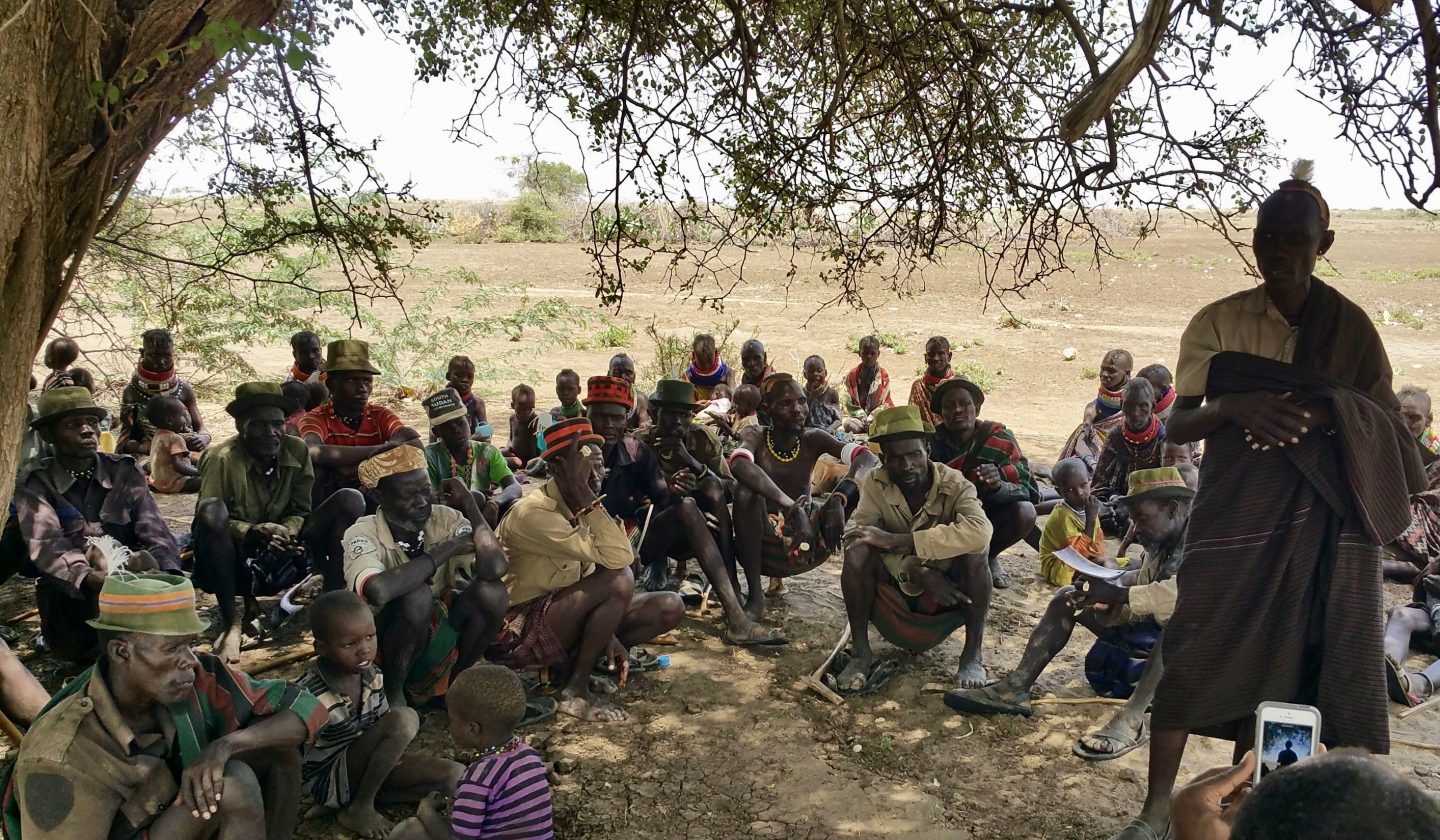 A village meeting under a tree with a nomadic Tribe in in Northern Kenya. These Christians live in perpetually dire straits as they walk 16km each day to try to trade wood for water at a nearby refugee camp. Many from the community have died from thirst, heat and starvation. Tim met with them to find out more about their struggles and to encourage them the best way he could.