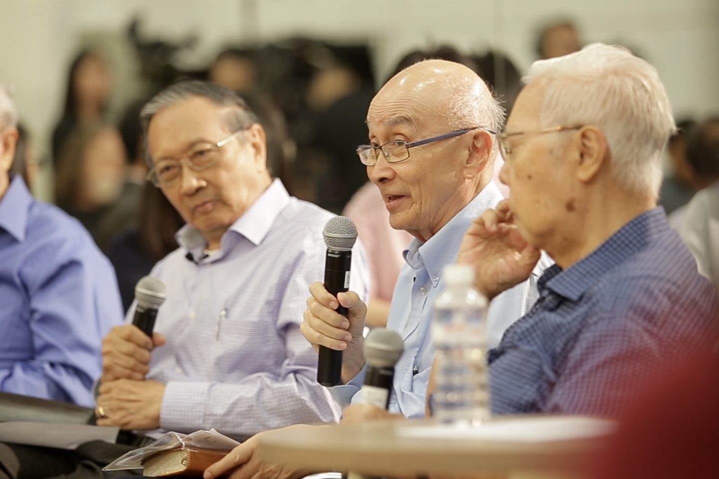 Ernest Chew, seated on the extreme left and Jim Chew, holding the microphone both served in the 1978 Singapore Billy Graham Crusade.