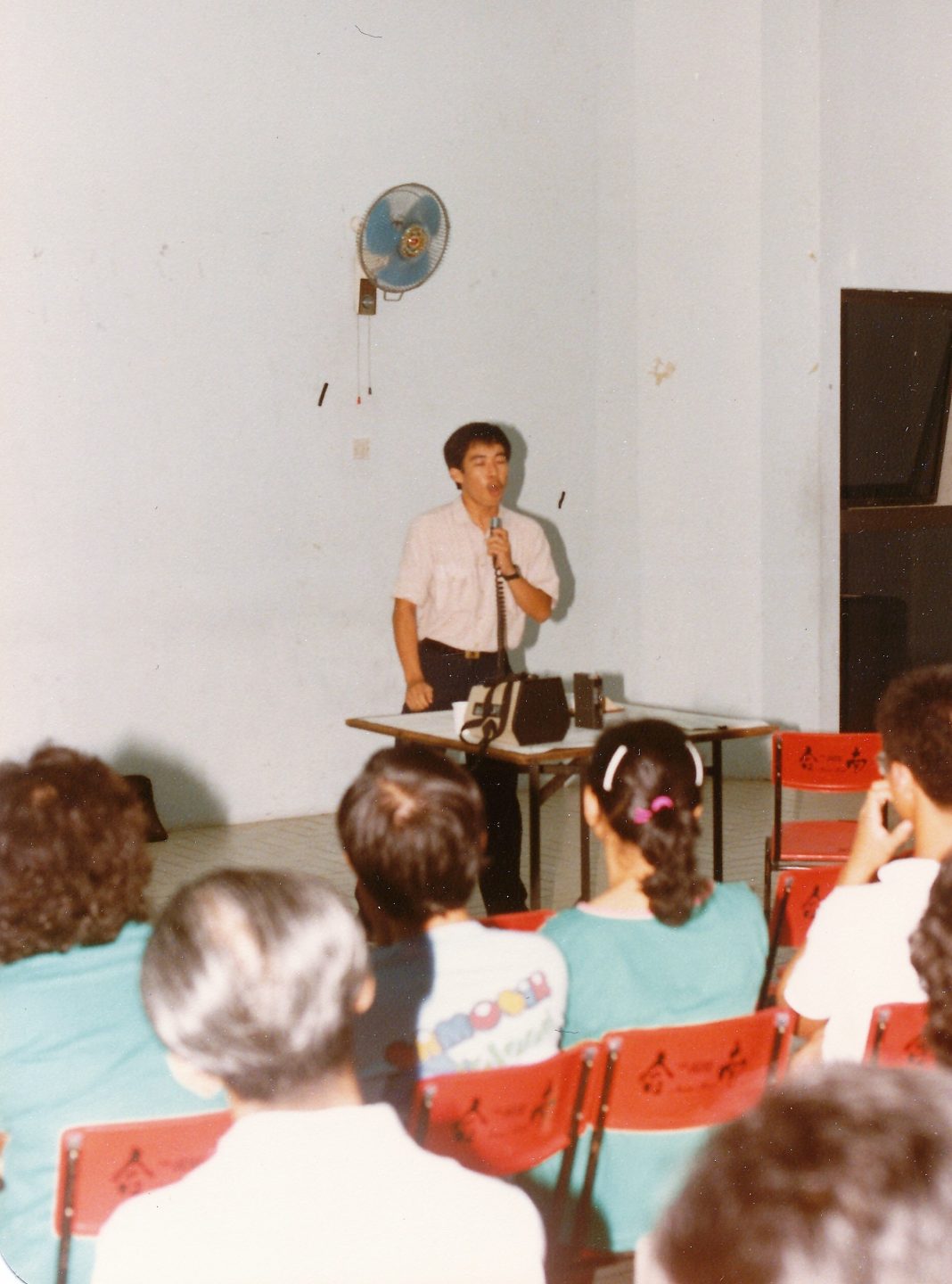 By his twenties, Pastor James Lim was a seasoned lay preacher. He is seen here in a HDB void-deck outreach organised by the then Calvary Charismatic Centre in 1985. Photo courtesy of Pastor James Lim.