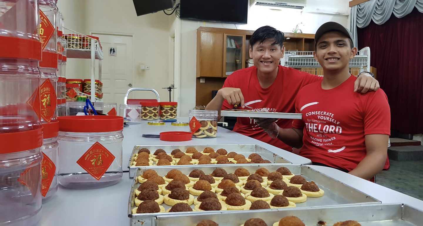 Bottled blessings: Residents at The Hiding Place pack their handmade pineapple tarts for Lunar New Year sales. Photo by Yeo Kai Wen.