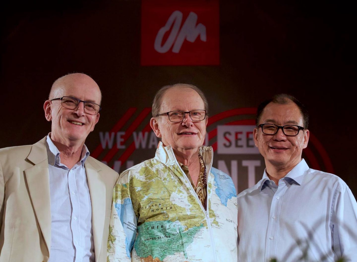 From left: Peter Maiden, George Verwer, founder of OM with his iconic world map jacket, and Lawrence Tong at OM's 60th Anniversary celebrations in 2017.