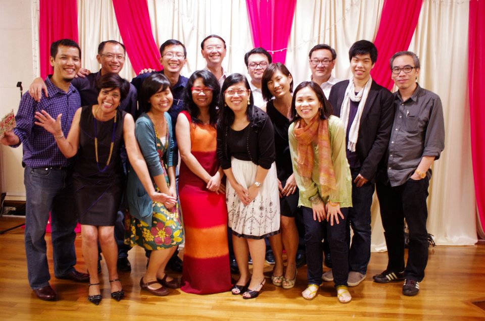 Tang (last row, second from left) and Dr Goh Wei Leong (last row, fourth from left) founded HealthServe in 2006 after discovering their shared concern for the underserved migrant worker community in Singapore. Photo courtesy of HealthServe.