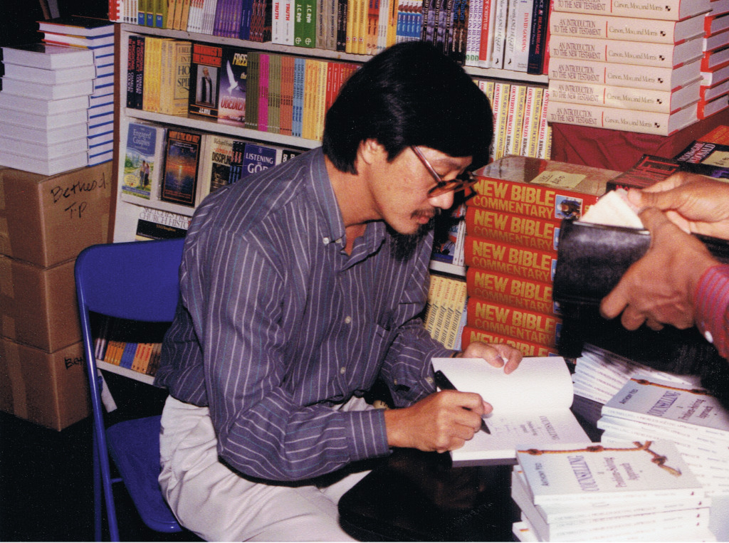 Anthony Yeo, a pioneer in counseling, autographs Counseling-A Problem Solving Approach at the Singapore Book Fair, 1993.
