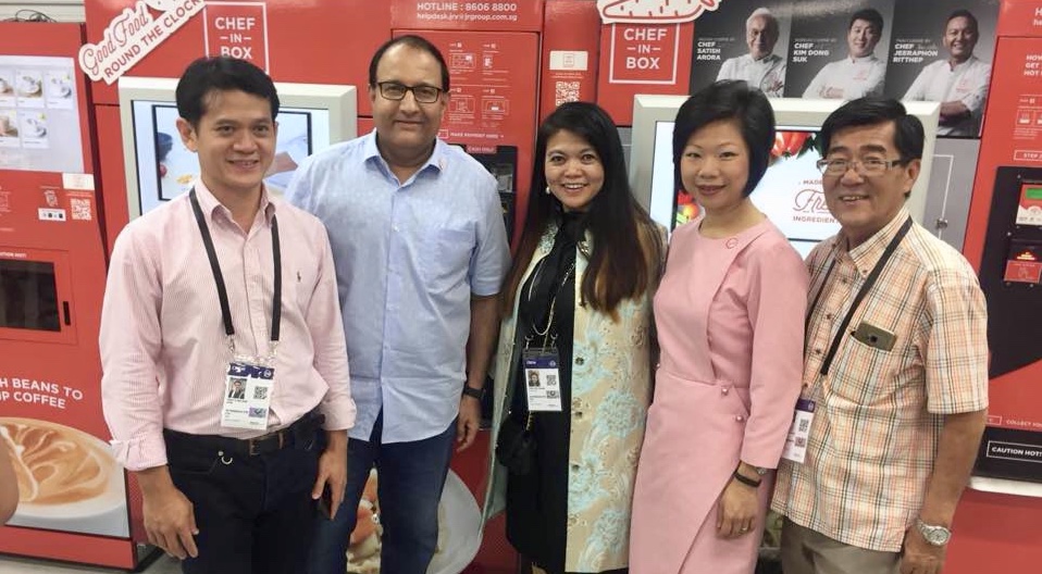 Senior Minister of State for Communications and Information, Sim Ann (second from right), and Communications and Information Minister S Iswaran (second from left), invited JR Group to set up their vending machines, Chef-in-Box, at the Trump-Kim Summit media centre in June 2018. All photos courtesy of Jocelyn Chng (centre).