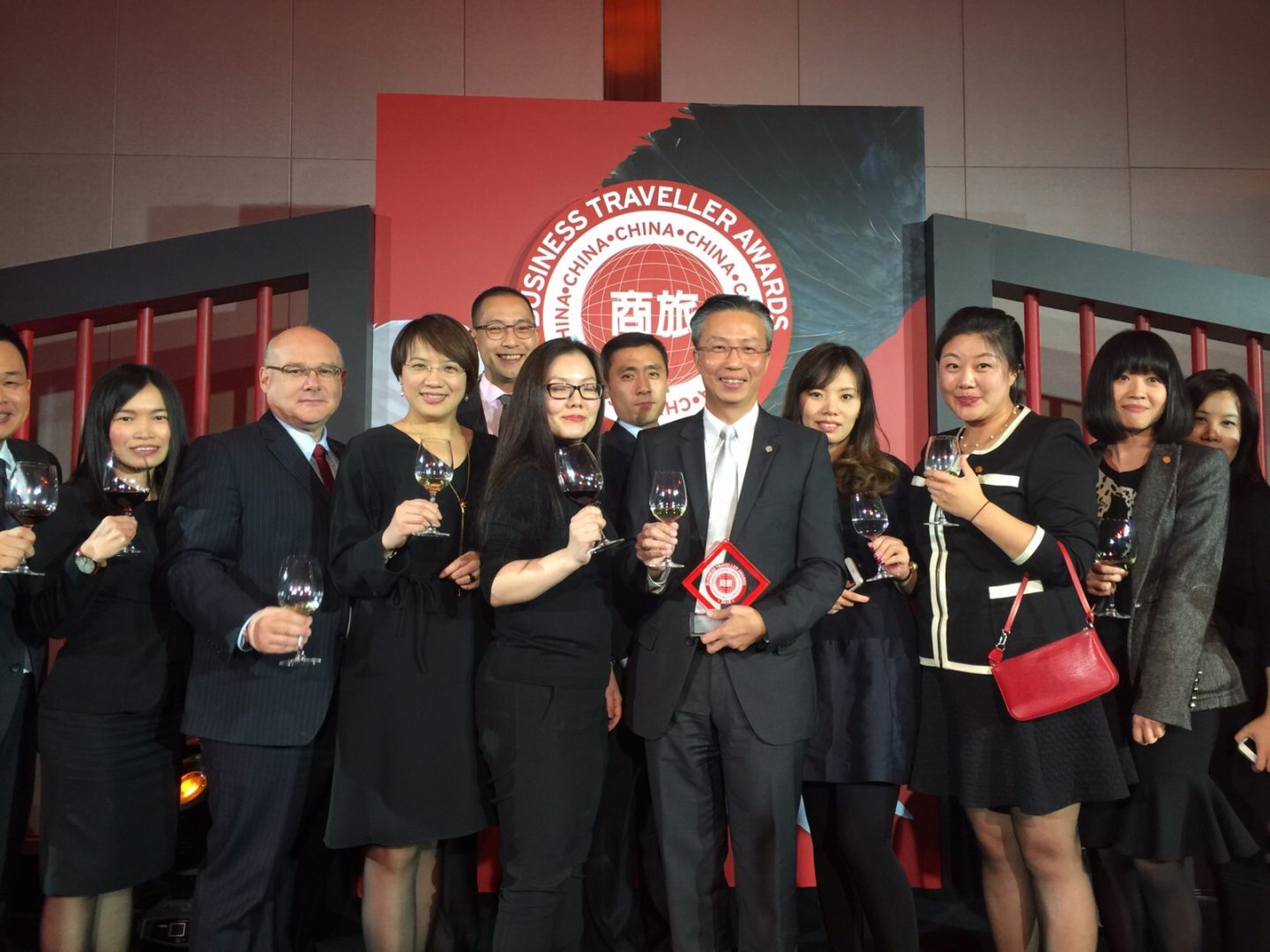 Choe and his team celebrating at the Business Traveller China Awards ceremony