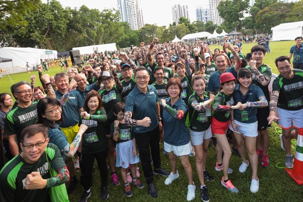 Runners and guests at the 2018 event proudly showing their tatooed armsleeves. More than 500 ex-convicts and their families were part of the 2018 event which drew over 4,200 people.