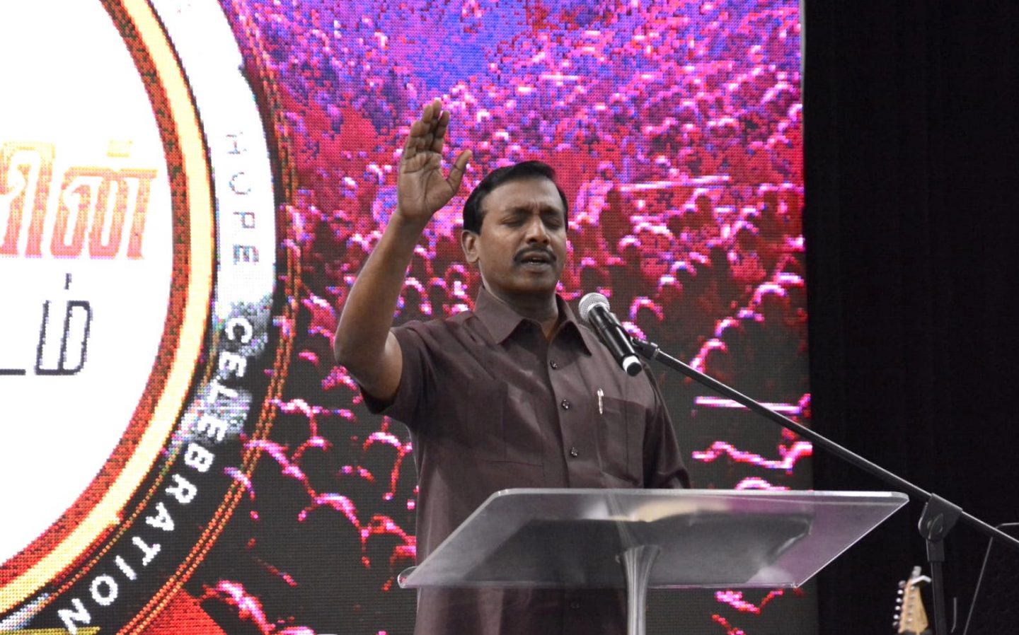 Brother Mohan C. Lazarus was the evangelist at the Tamil rally. Photo by Calvin Mak.