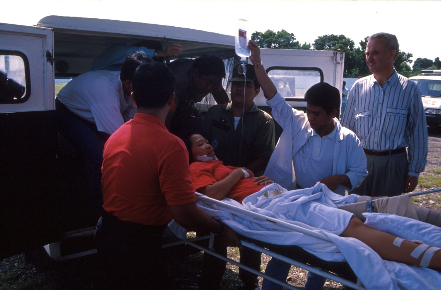 One of the over 30 victims of the 1991 terrorist attack at a public Doulos presentation being wheeled away by medics.