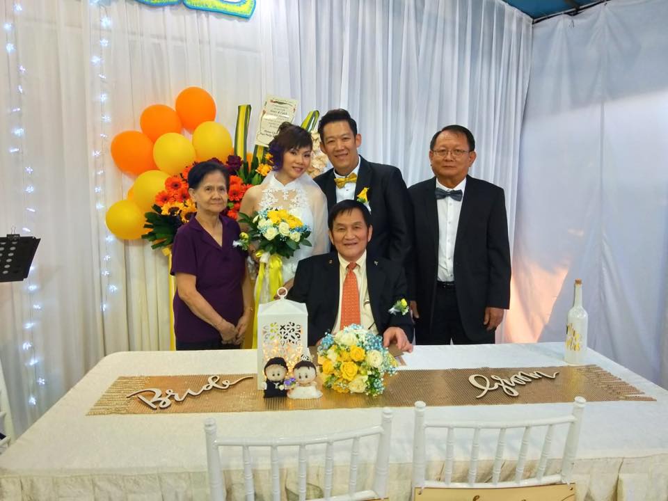 Pastor Philip (seated) officiated Caleb and Grace's wedding last August. Pastor Tan Hock Seng (right), THP's home director, was one of the official witnesses. Photo courtesy of Caleb Tan.