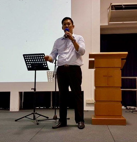 Caleb sharing his testimony at a Singapore church. Photo courtesy of Caleb Tan.