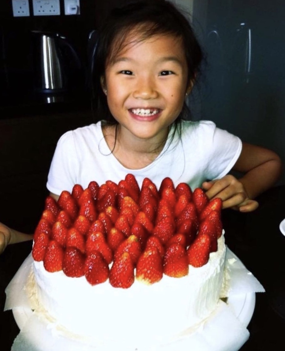 Cheryl with the very first strawberry shortcake that she baked together with her mother, Jenny.
