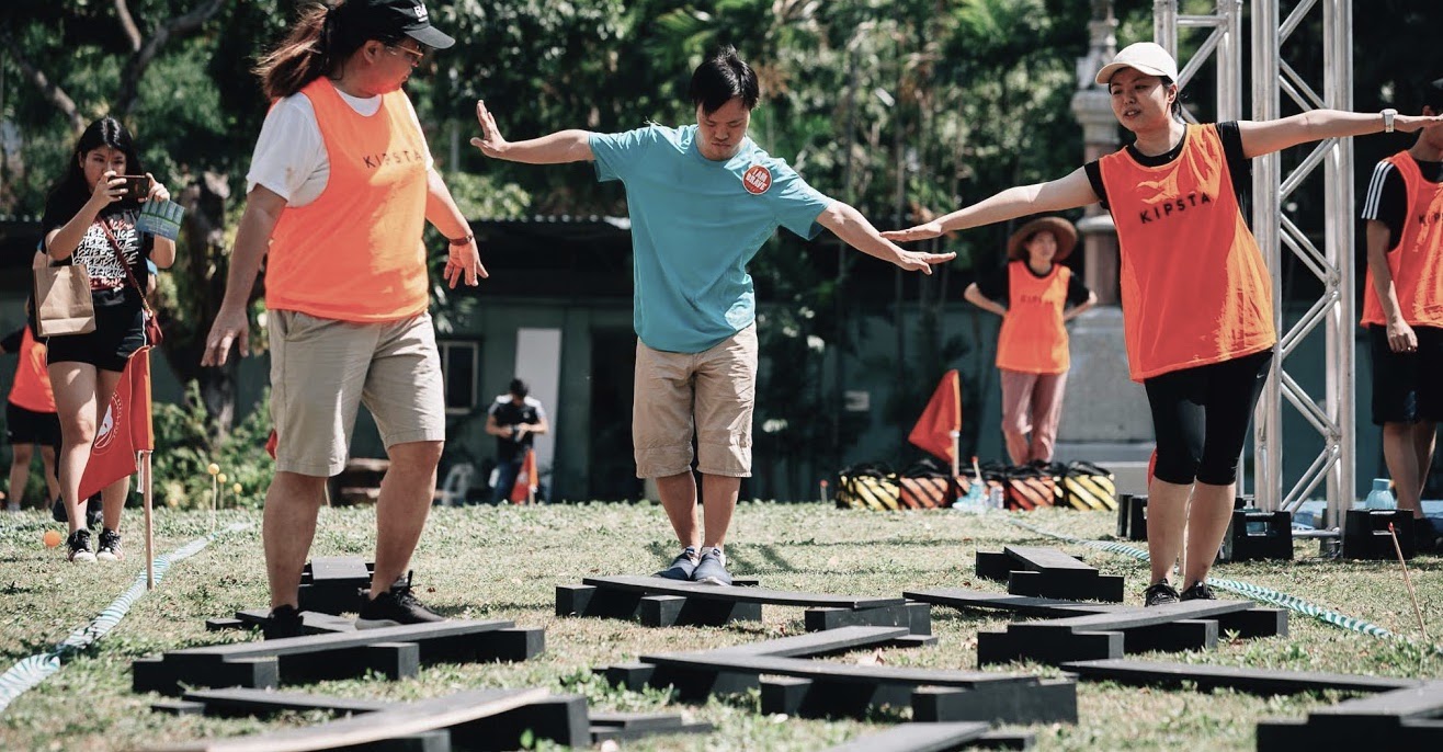 A special needs participant taking on The Brave Race with assistance from volunteers. Photo courtesy of LifeFest