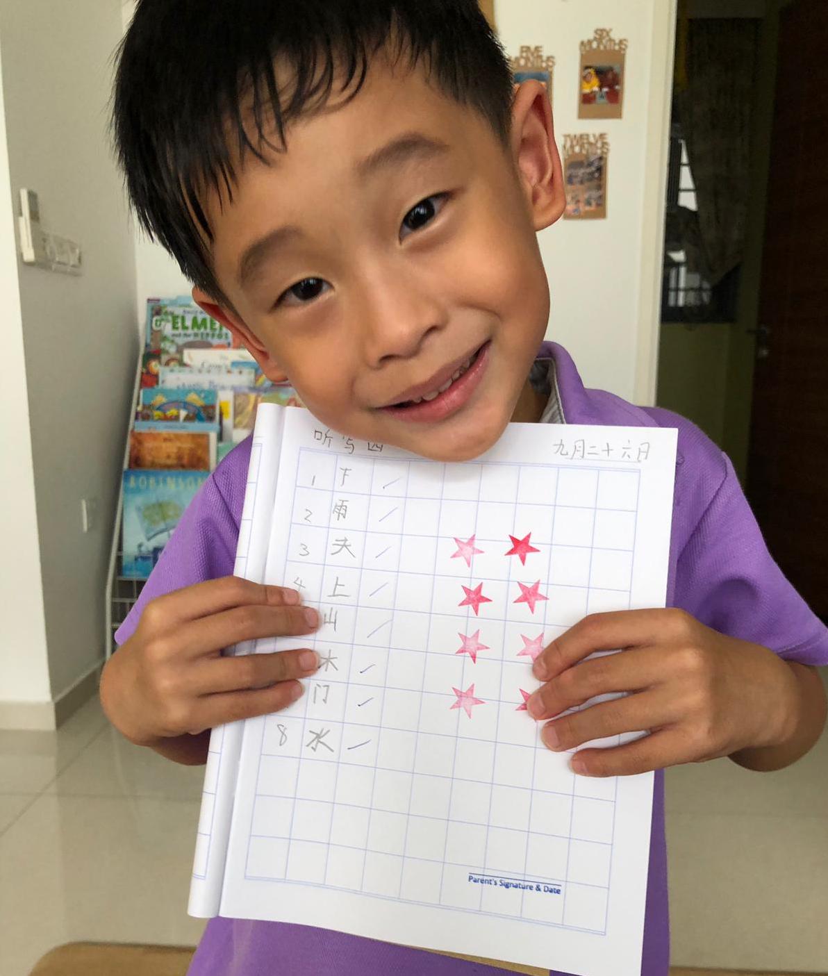 September 26, 2019: Ethan Ong scored full marks on his latest test – with "miraculously legible" handwriting, according to Pastor Felicia. Photo courtesy of Ps Felicia Goh-Ong