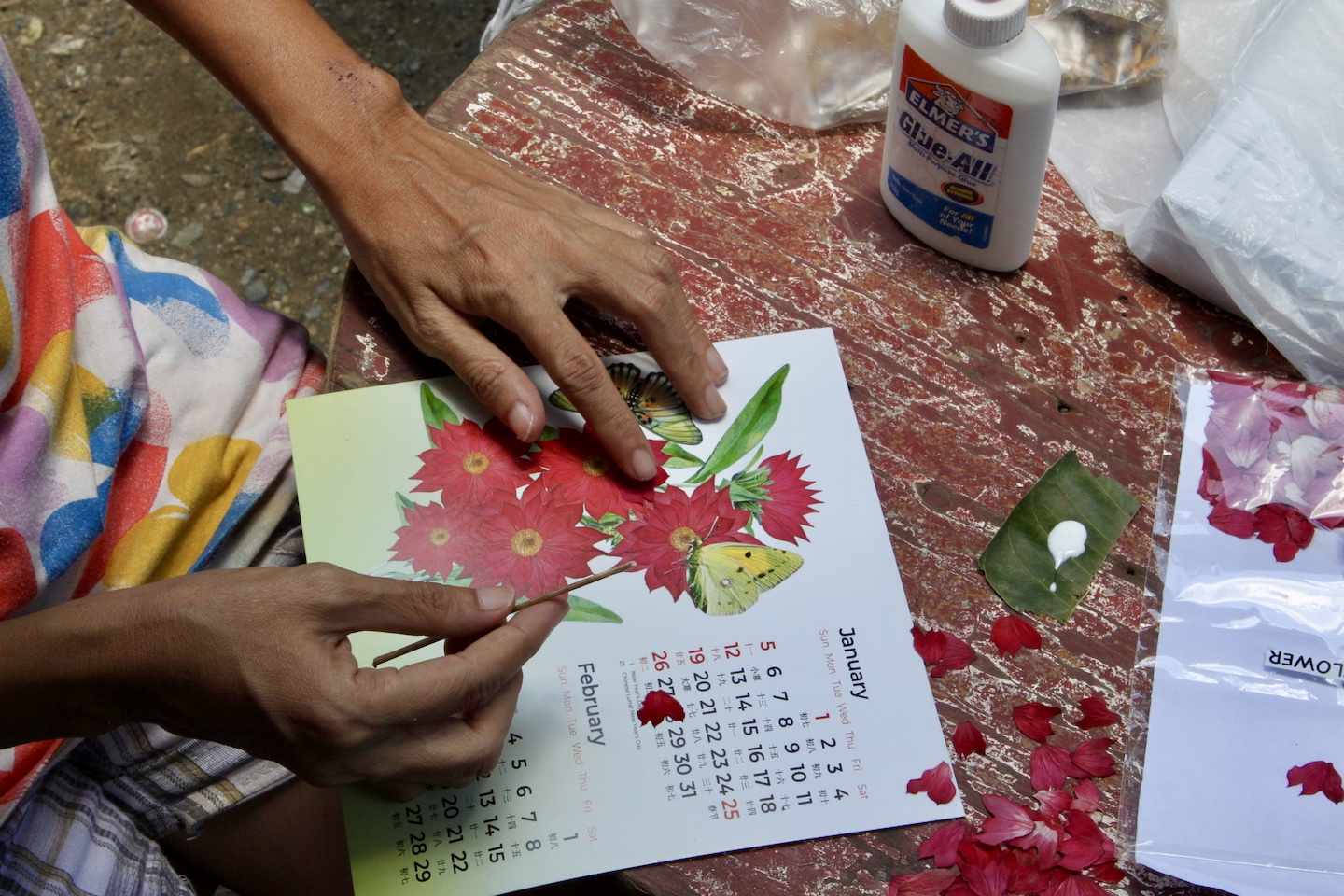 Susan has not only learned a new skill by participating in CCI's livelihood programme creating pressed flowers craft, she has also managed to supplement her household income through it.