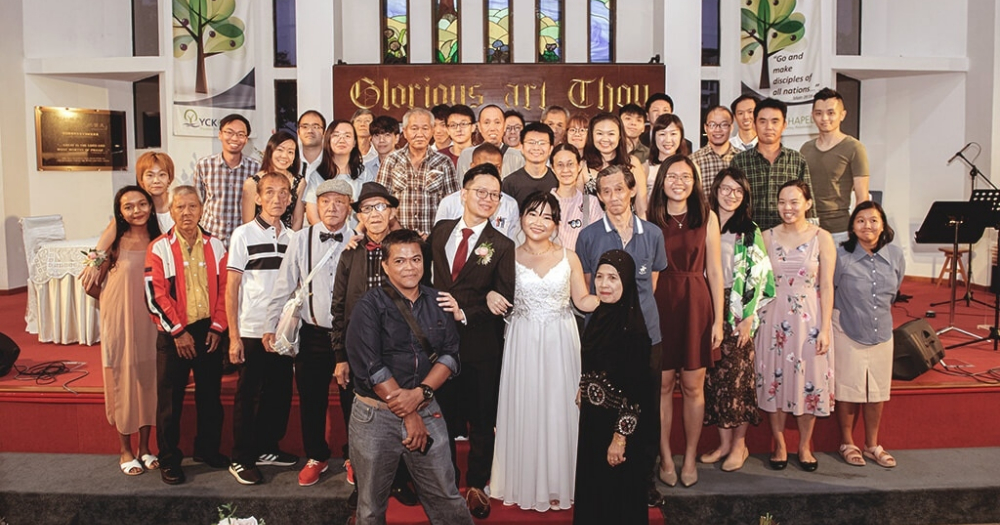 Abraham Yeo and Peng Cheng Yu with some of the guests that attended their wedding — including their friends from Homeless Hearts. Photo courtesy of Abraham Yeo.
