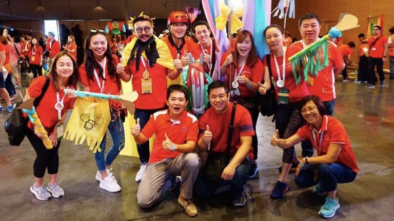 “I never saw this as a business, I saw this more like a ministry, to love and help people,” says Ronald Seet (top row, extreme right), financial services director and wealth manager at Prudential Singapore. He is pictured here with his team. All photos courtesy of Ronald Seet.