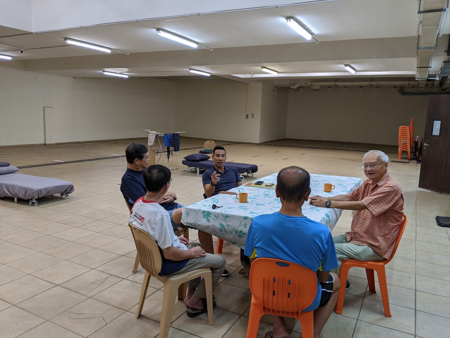 Every night, befrienders from Yio Chu Kang Chapel come down to fellowship with the homeless staying in their church. The church also provides beds, warm showers and snacks. Photo by Gracia Lee.