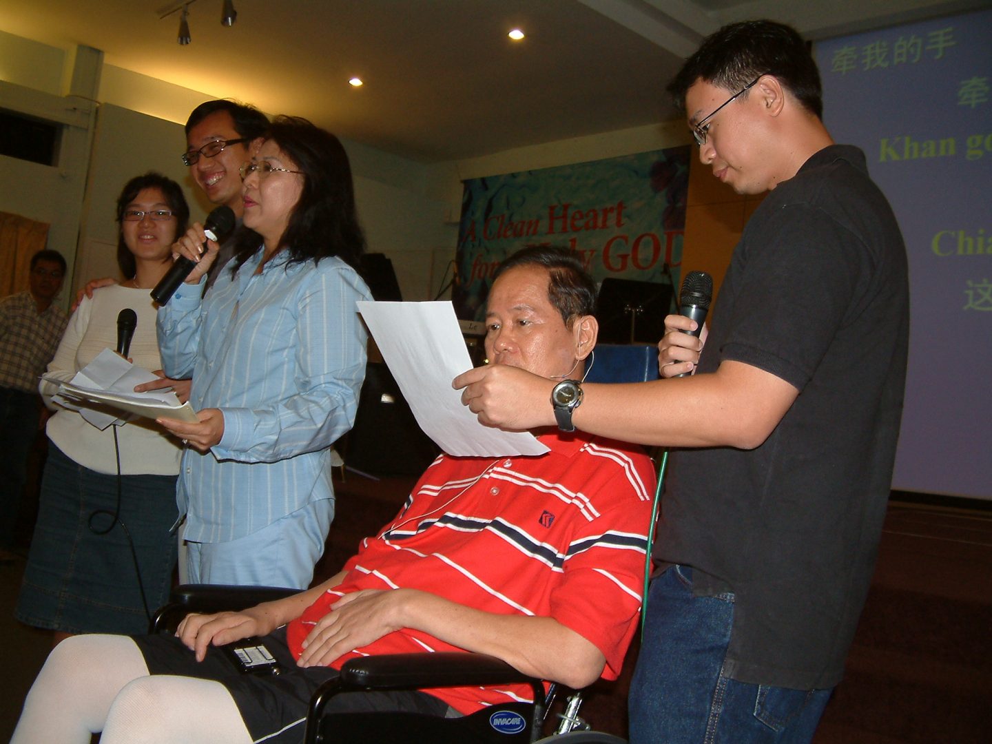 Ps Ling's father (in orange) readily testified to God's goodness and faithfulness by sharing his testimony at various churches. Photo courtesy of Ling Kin Lew.