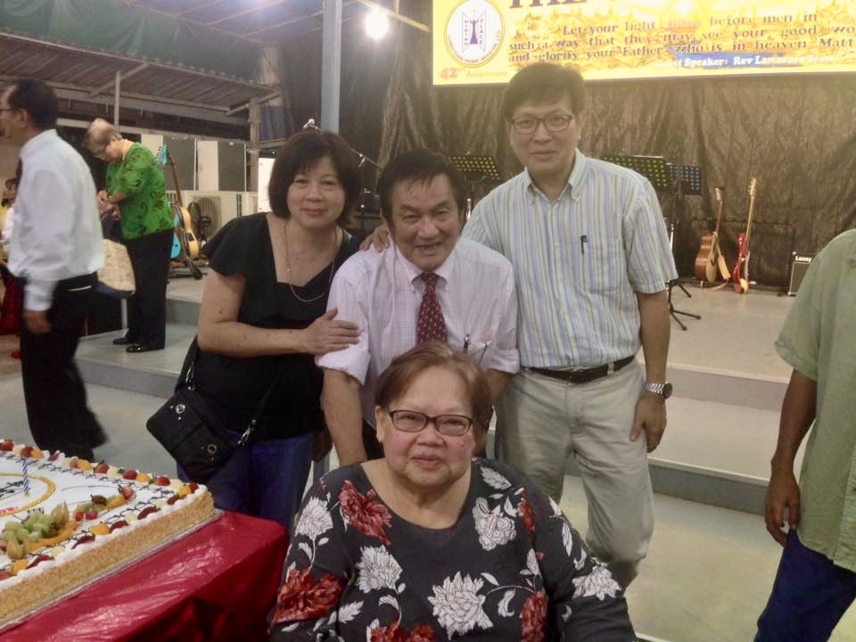 Jenny Cheng (left) and her husband, Mike Tan (right), together with Ps Philip and Christina. It was during her brother's time in The Hiding Place that Jenny got to know the Lord. Photo from Ps Philip Chan's Facebook.