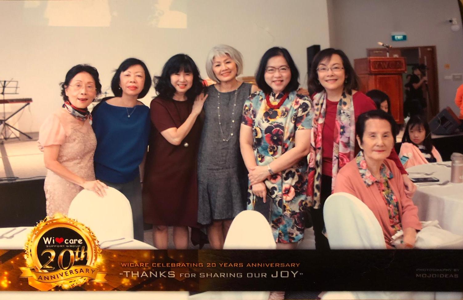 Esther (centre, in grey) with some women in her prayer group at Wicare's 20th Anniversary celebration in 2018.