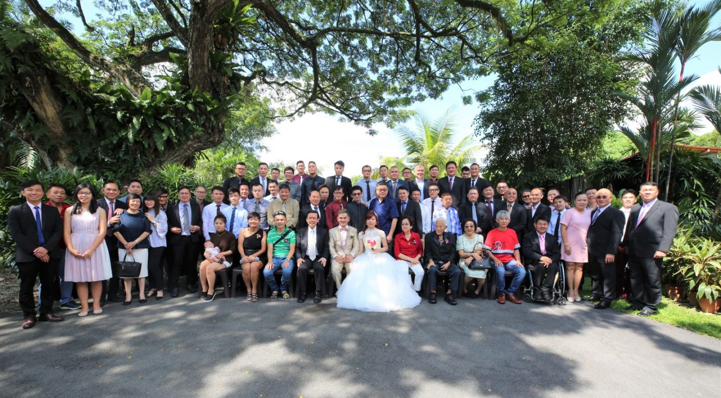 Many turned up to celebrate their nuptials. They are pictured here with the big family that they have found in Breakthrough Missions.