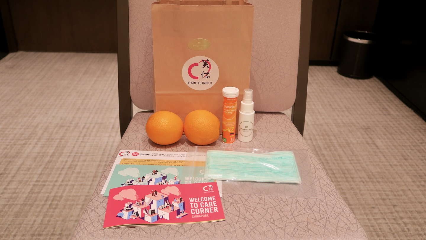 Each care pack includes surgical masks, a bottle of hand sanitiser, Vitamin C, fresh fruits, as well as educational materials. Photo from Care Corner Singapore.