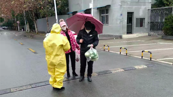 Christians clad in full yellow protective suits have taken to the streets distributing free masks and Gospel tracts. Photo taken from  https://heartcrymissionary.com/mission-updates/a-door-opened-in-wuhan-china/