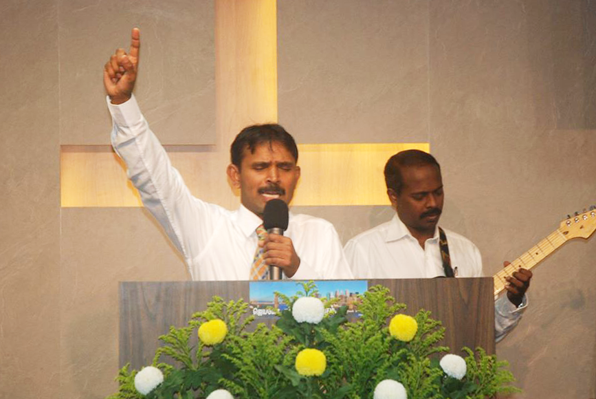Once a migrant worker from India himself, Ps Selvasingh is now a pastor to many others like him. Photo taken from GEMS Tabernacle's Facebook page.
