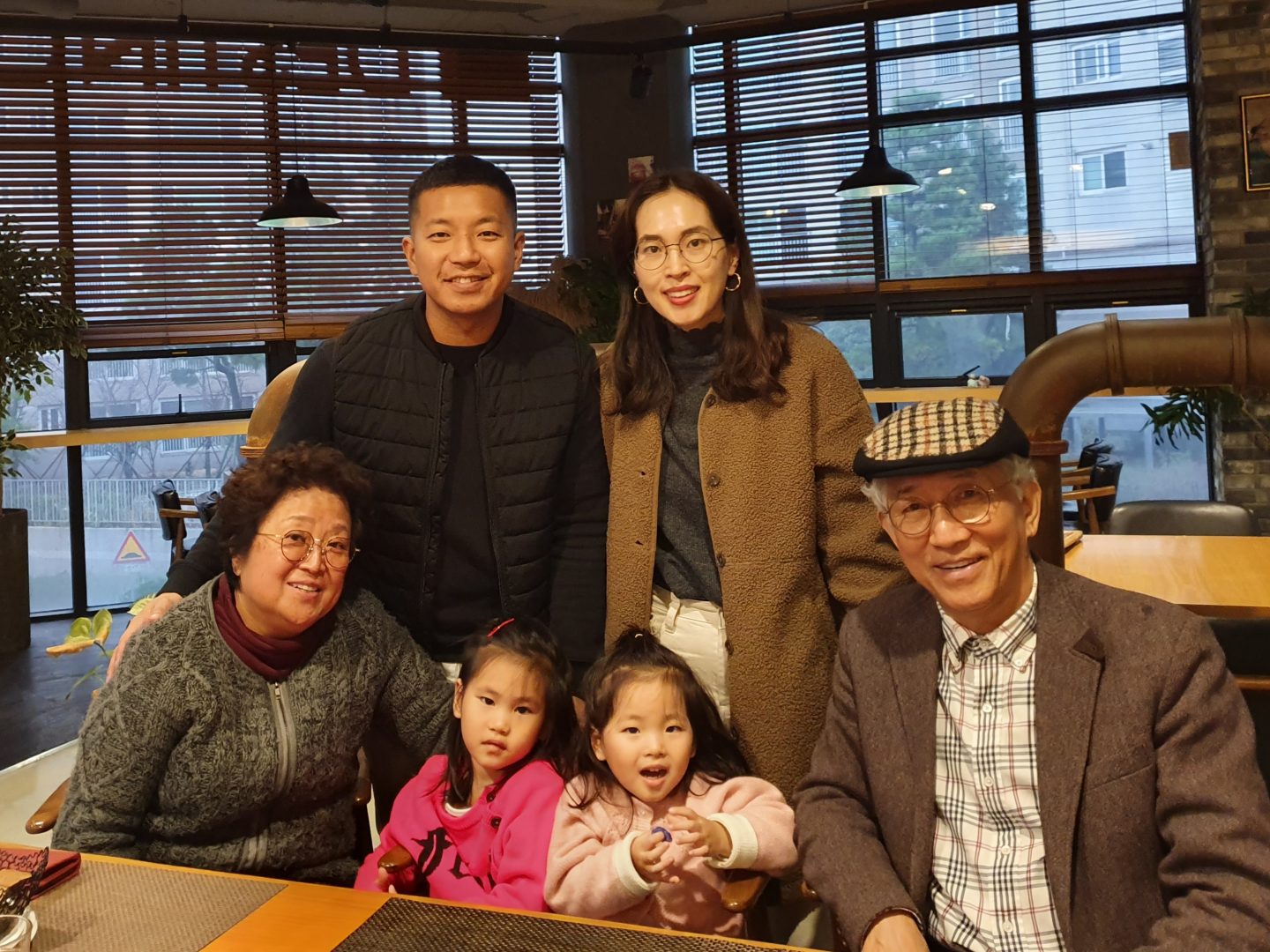 Nan and Han Jung with Hudson, his wife, Grace, and their two daughters.
