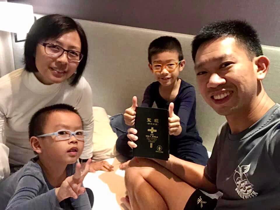The Sums enjoying family devotions while on holiday. Photo by Sum family.