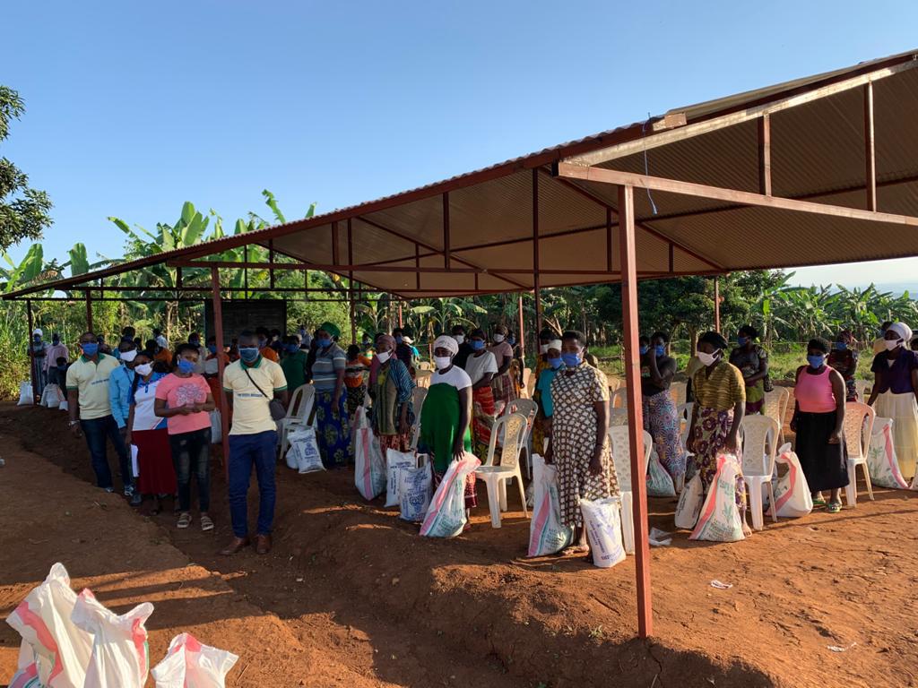 Distributing food to HIV-positive widows in Rwanda. During this time, many of them took the initiative to sew masks for their fellow villagers, said Ooi.