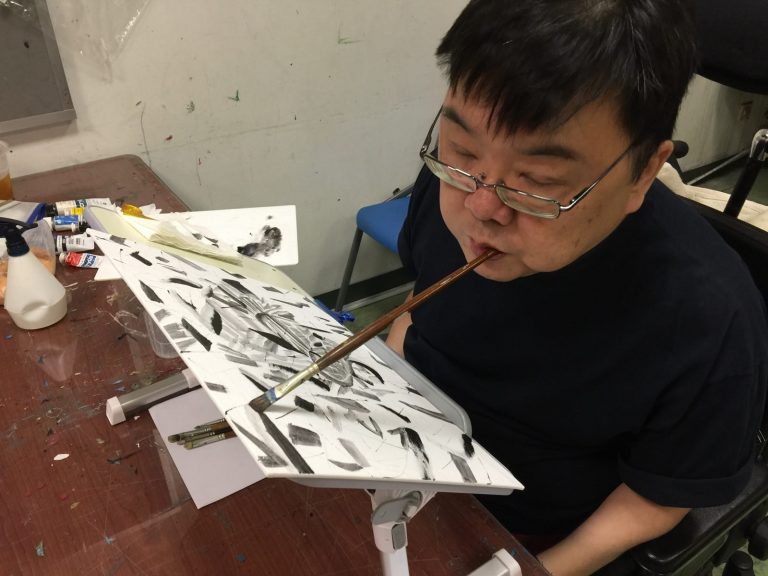 Gilbert Tan at a Nanyang Academy of Fine Arts lesson in 2016. He became a tetraplegic after a swimming accident at age 22 and picked up mouth painting later to become a world-renowned artist. All photos courtesy of Gilbert Tan.