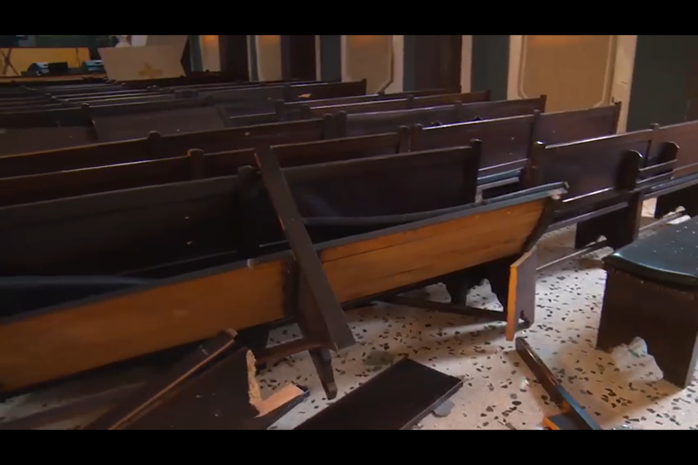 Pews in the church sanctuary destroyed from the impact of the blast