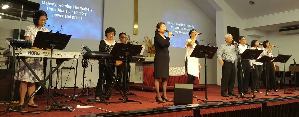 Never too old to serve the Lord, Lim Suat Khoh (middle on the keyboard) and her husband Lim Teck Seng (fourth from the right) joining the seniors in leading worship at Paya Lebar Chinese Methodist Church. Photo courtesy of the Lims.