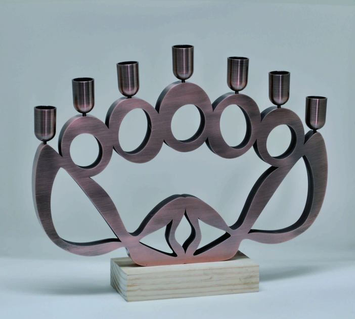 The <i>Five Loaves and Two Fish Menorah</i> by Mann Chow is made of steel, zinc, alloy and wood, based on the miracle in the Bible where Jesus fed 5,000 people in His Mercy. Photo by Sound of Art. 