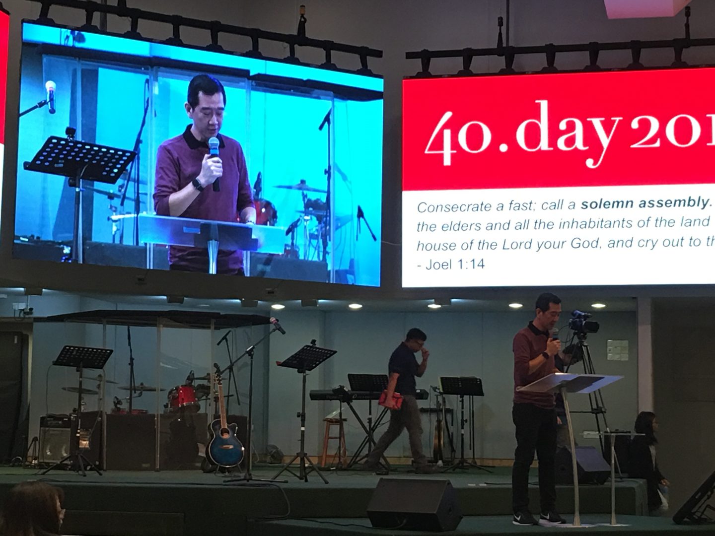 Kok Hiang speaking at a LoveSingapore 40-day prayer event.