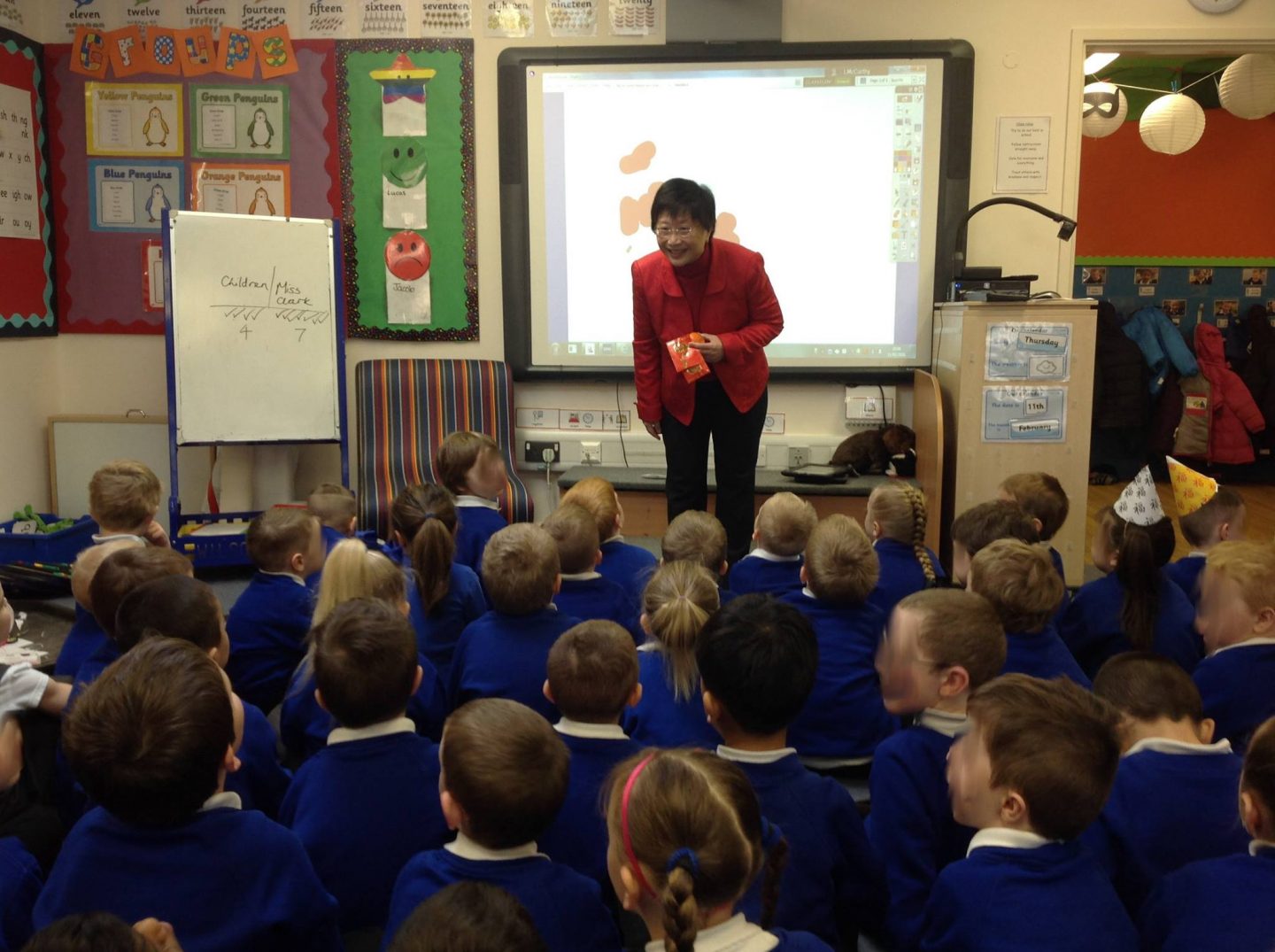 Rev Eileen Harrop speaking to British primary school children about Chinese New Year.