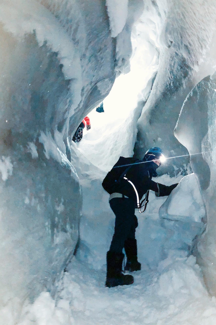 Wesi exploring an ice cave in Longyearbreen