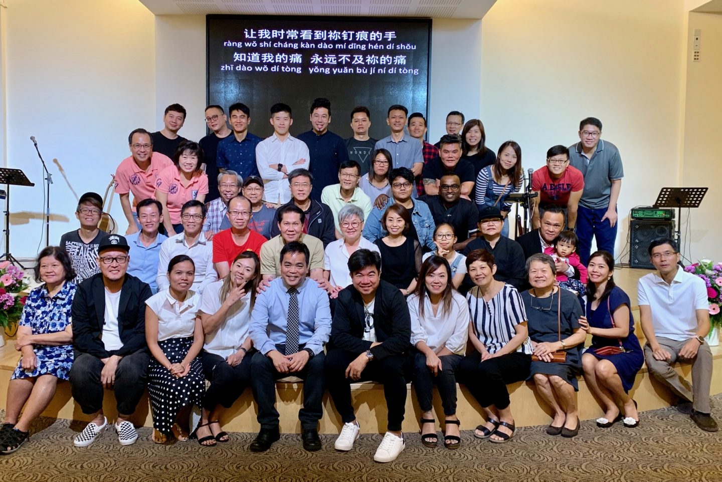 Pastor Joshua (first row, fifth from left) and members of the New Life Group at WEFC. Operating on the principle of unconditional love, he leaves it open to members to choose whether or not to disclose their pasts. But there is a sense of shared ownership where even the families of inmates are supported so that no one goes through the difficult season alone. NLG members are also integrated into the larger church body because they do not want to perpetuate stereotypes and allow feelings of discrimination to fester. 