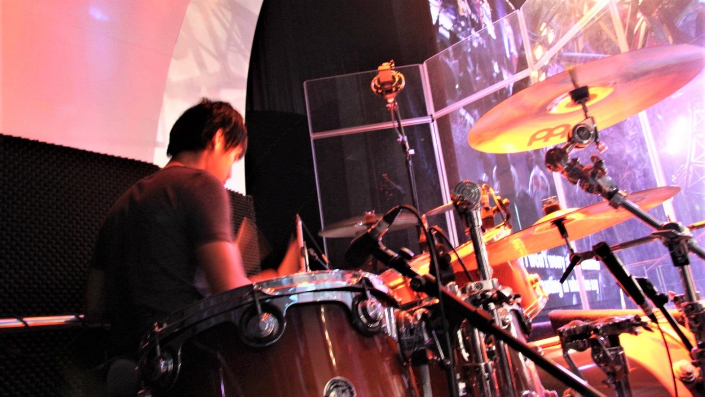Poh playing the drums in church. Being in a Christian community helped him get out of gaming during his Secondary School days.