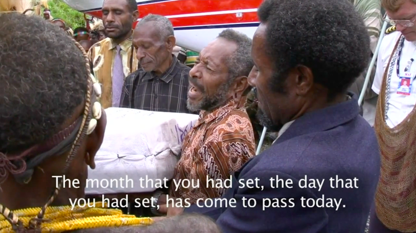 Pastor Siud from the Kimyal tribe receiving a parcel holding the first New Testament Bible in his language. Screengrab from Imagine Life without the Bible.