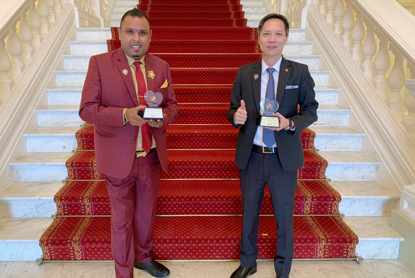 Pastor Samuel (left) and Rev Ezekiel Tan (right), President of Hope Initiative Alliance (HIA) at the Istana with their awards on Friday, October 16. 