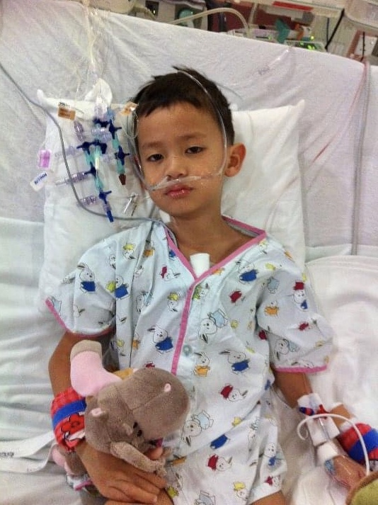 Elijah, several days after most tubes were removed from him. He spent two weeks in the PICU in Singapore. 