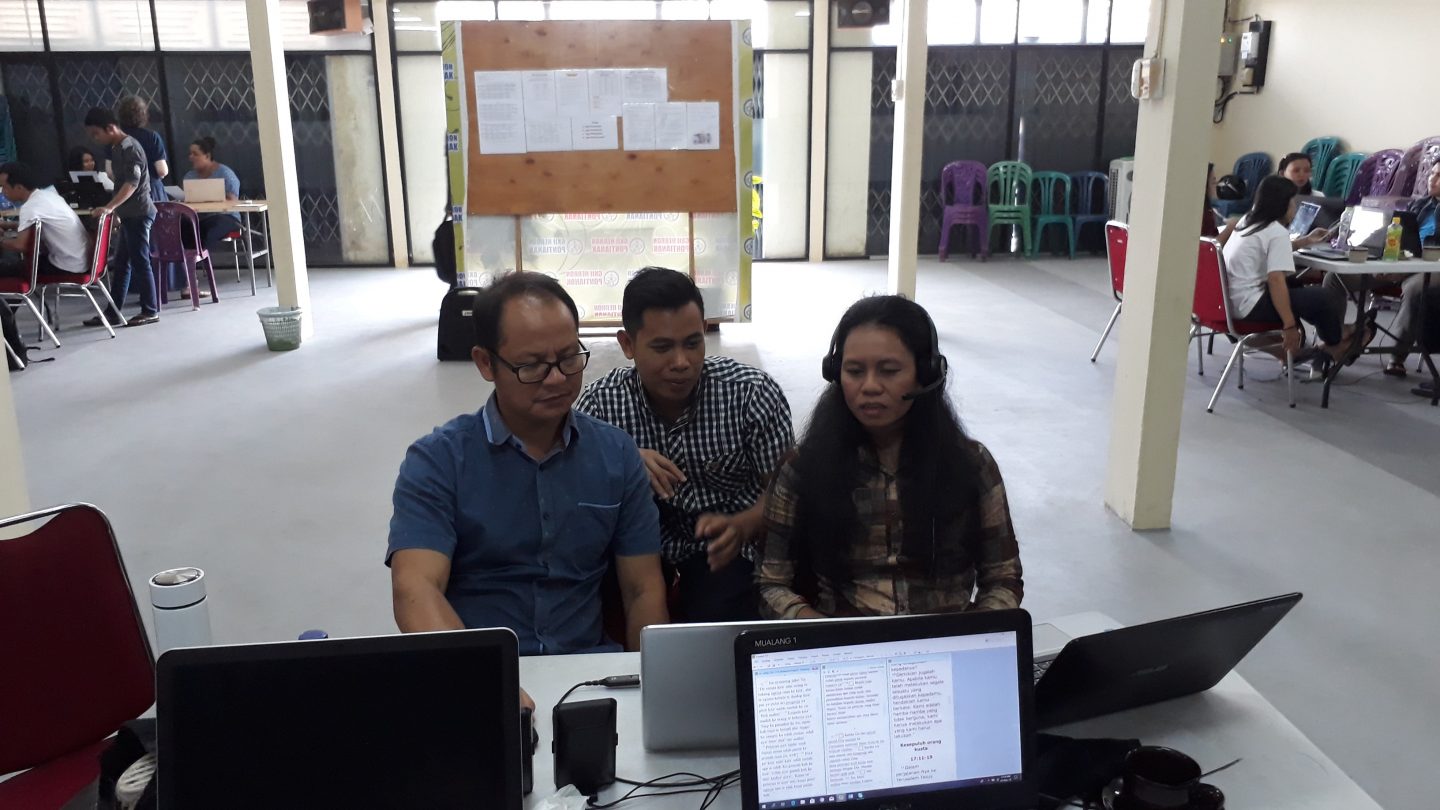 The three translators from Mualang, including Adi middle, working on the Jesus film during a workshop in Pontianak, the capital of West Kalimantan. Photo courtesy of Kartidaya.